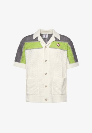 Cardigan a maniche corte in maglia con blocchi di colore bianco, grigio e verde lime, chiusura con bottoni, due tasche e colletto.