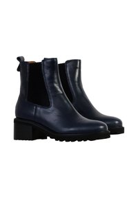 Botas de tobillo de cuero azul marino con paneles laterales elásticos, una suela de goma texturizada y un tacón cuadrado, con un tirador en la parte trasera.