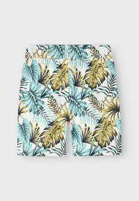 Pantaloni da bagno a fantasia con grandi foglie tropicali in aqua, giallo e nero su uno sfondo bianco, con vita elasticizzata.