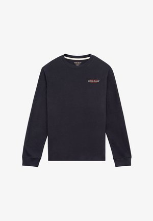 Sötétkék hosszúujjú pulóver, pamutból készült, kerek nyakkivágással és bordázott mandzsettákkal. A mellkasán egy kis piros "GUESS JEANS" logó található.