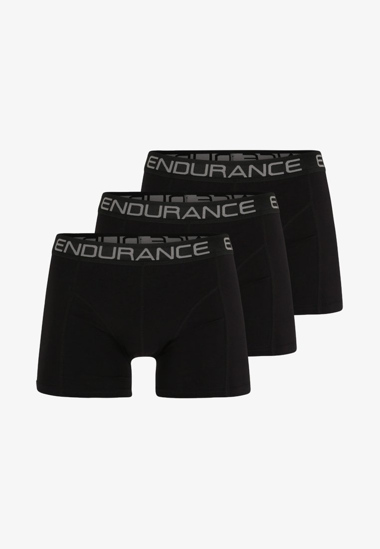Culottes nere in un pacco da tre con un'ampia vita grigia su cui è stampato "ENDURANCE". Il tessuto ha una texture liscia e elasticizzata.