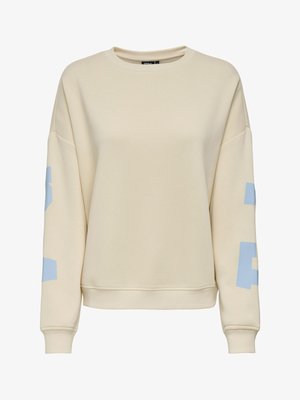 Bluză bej cu mâneci lungi și guler rotund, cu litere albastre deschise pe mâneci, manșete și tiv striate, croială casual și lejeră.