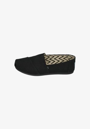 Black slip-on shoe with a textured fabric upper, featuring a streamlined design and a rubber sole. Interior has a chevron pattern.