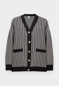 Black and white houndstooth cardigan with V-neck, black trim, two front pockets, and six metallic buttons down the center.