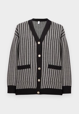 Black and white houndstooth cardigan with V-neck, black trim, two front pockets, and six metallic buttons down the center.