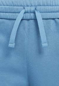 Nike Sportswear SPORTSWEAR CLUB FLEECE - Calças de fato de treino - aegean storm