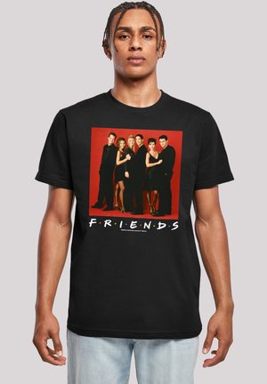 Black t-shirt featuring a central graphic of six individuals on a red background. Text at the bottom reads "F.R.I.E.N.D.S." in white.