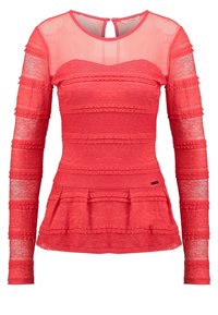 Top largo de manga larga texturizado en rojo con detalles de encaje, dobladillo peplum, paneles transparentes y escote redondo; cierre en el escote de la espalda y etiqueta de la marca en el dobladillo.