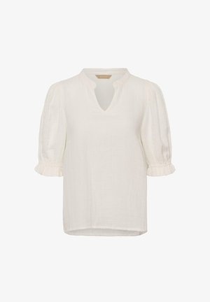 Blouse blanche à manches courtes bouffantes, poignets volantés, texture subtile et petit col en V.