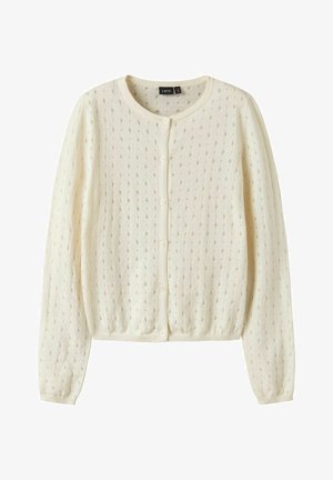 Kremasto obojeni džemper s dugim rukavima, skučenim prednjim gumbima i suptilnim dijamantnim uzorkom s rupicama po cijelom dizajnu.