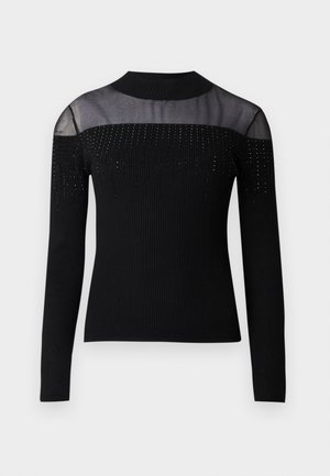 Pull noir côtelé à manches longues, avec un panneau supérieur en tissu transparent noir et des ornements de petits clous étincelants le long du décolleté.