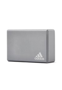 Gray rectangular yoga block with a smooth texture; features rounded edges and an embossed Adidas logo on one side.