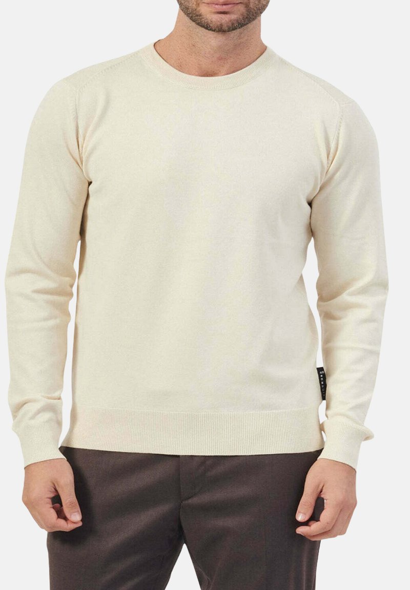 Maglione color crema a maniche lunghe realizzato in tessuto morbido. Presenta un collo rotondo, polsini e orlo a costine. Etichetta sul lato sinistro.