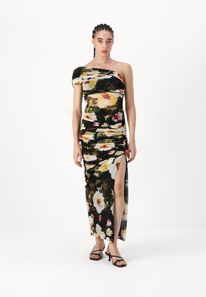 Black floral maxi dress with one shoulder design, ruched texture, and a thigh-high slit. Features vibrant yellow and pink flowers throughout.