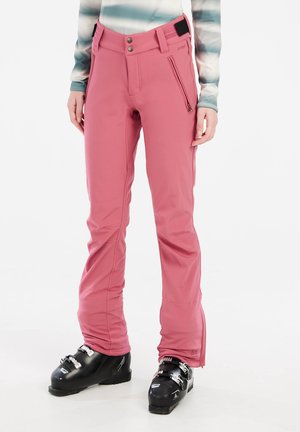 Pink ski pants with a fitted design, zippered pockets, and adjustable waistband. Material appears lightweight and water-resistant, with a smooth texture.