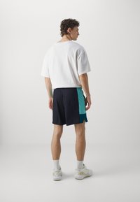 Under Armour ZONE - Spordišortsid - black/radial turquoise