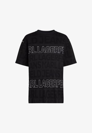 T-shirt nera con grande testo bianco del marchio "KARL LAGERFELD" e "JEANS" con opacità variabile. Collo rotondo classico, maniche corte. Texture del tessuto liscia.