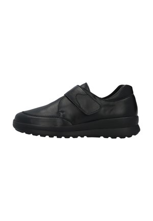 Black leather sneaker with a rounded toe, adjustable Velcro strap, and textured rubber sole for grip and stability.