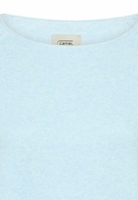 Light blue crew neck sweater with visible fabric texture and a small camel brand label inside the collar.