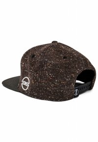 Snapback cap with a textured dark brown fabric featuring colorful flecks. Black brim and adjustable strap at the back with logo detail.