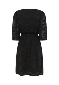 Robe noire longueur genou avec manches trois-quarts transparentes et motif floral en relief, avec taille élastique.