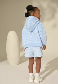 Next Teplákové kalhoty - blue ditsy floral