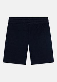 Pantalones cortos azul marino de algodón suave con una cinturilla elástica. Presenta una textura suave y bordes dobladillados para mayor durabilidad.