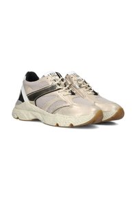 Sleek, light beige sneakers with mesh and synthetic upper, black accents, textured sole, and rounded toe. Laces and logo on tongue included.