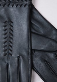 Black leather gloves with a smooth texture, featuring decorative stitching and a fitted design. Notable details include raised stitching patterns.