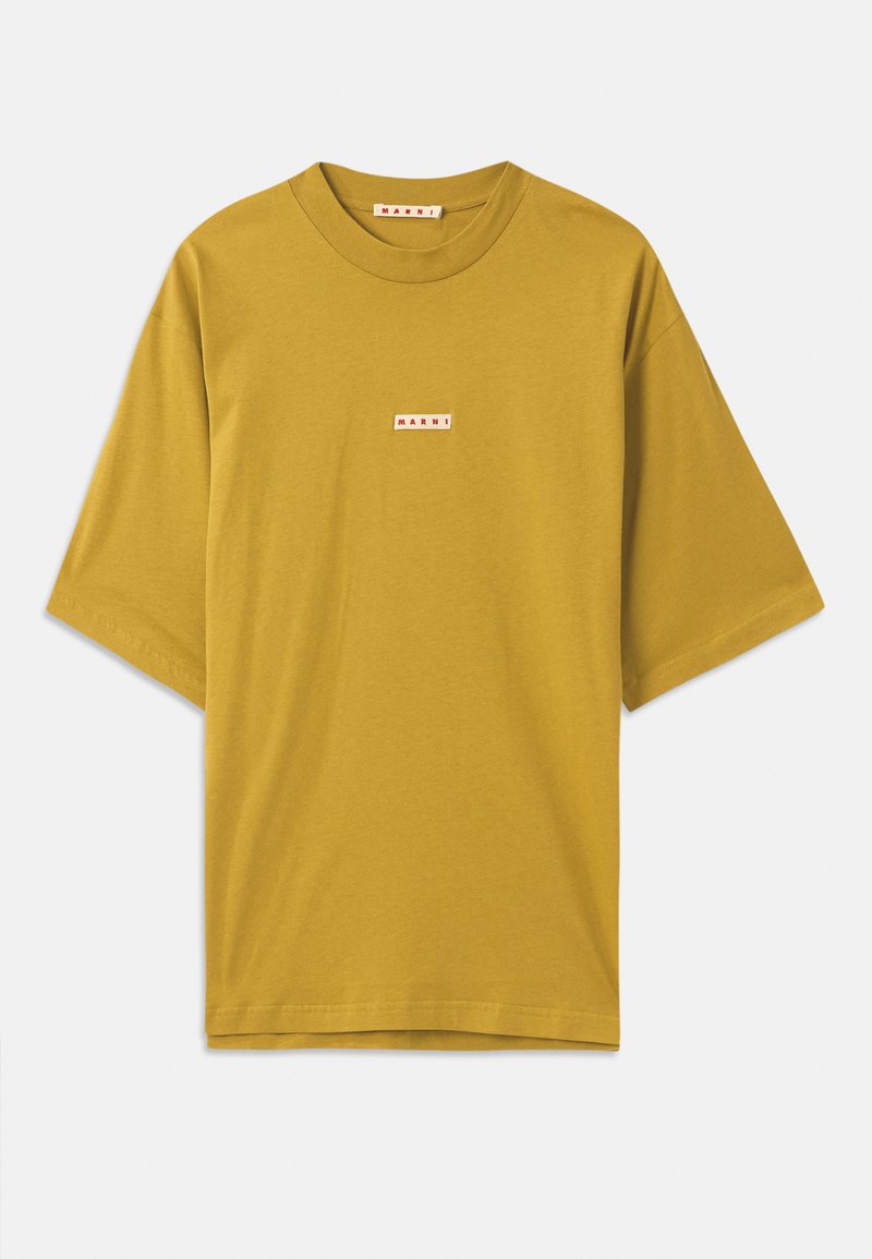 Mustard yellow cotton t-shirt with a round neckline, short sleeves, and a small rectangular label featuring the brand name in red.