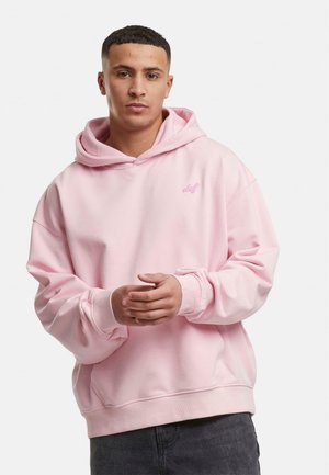 Pink hooded sweatshirt with a relaxed fit, featuring a small logo on the chest, ribbed cuffs, and a soft cotton blend texture.