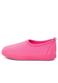Pink slip-on shoe made of smooth, flexible material. Low-cut design, round toe, textured rubber sole, and stitching along the opening.