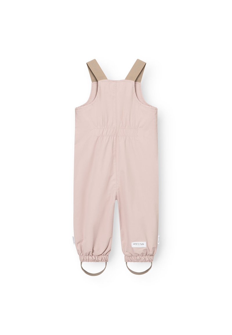 Salopetă pentru copii de culoare roz pal, cu bretele bej, manșete elastice la glezne și un spate plisat pentru confort. Fabricată dintr-un material ușor.