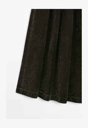 Black velvet garment with a smooth texture, featuring pleats and a straight hem. The fabric has a subtle sheen and rich depth.