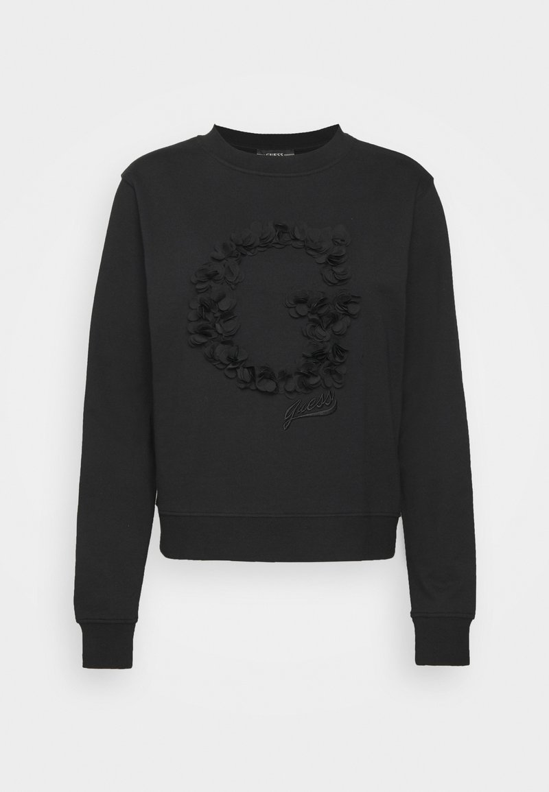 Sudadera negra con cuello redondo, con un diseño floral texturizado que forma una "G" y el nombre de la marca "Guess" en cursiva en la parte inferior.