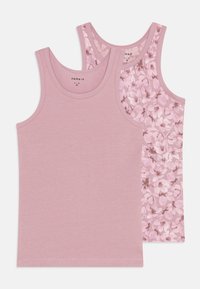 Two pink cotton tank tops: one solid color and one with a floral pattern, featuring wide straps and a stitched hem.