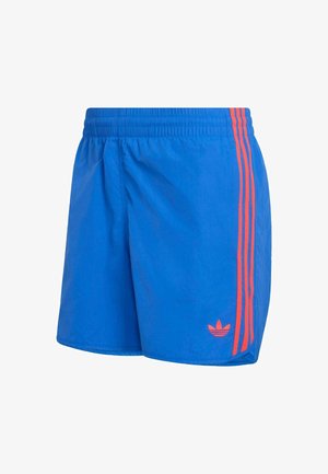 Niebieskie spodenki sportowe z elastycznym paskiem w talii, ozdobione dwoma pionowymi pomarańczowymi paskami i małym logo przy krawędzi.