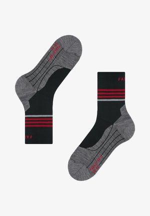 Schwarz-graue Socken mit roten und grauen Streifen, einer verstärkten Ferse und rotem Text mit der Aufschrift "FAKE-FUR 42-43" auf der Unterseite.