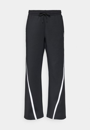 Čierne tepláky s pásom na šnúrku, s bielymi bočnými pruhmi, vreckami a voľným strihom. Vyrobené z mäkkej, odolnej tkaniny.