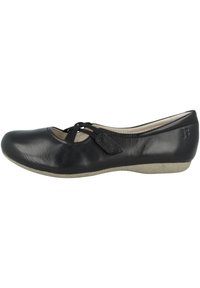 Black leather ballet flats with a rounded toe, elastic strap detail, and a low beige rubber sole. Smooth texture with minimal stitching.