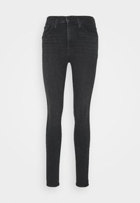 Vaqueros skinny de tiro alto en negro, hechos de denim, con una textura suave, cinco bolsillos y un cierre clásico de botón y cremallera.