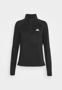 Schwarzer Langarm-Pullover mit einem Viertelreißverschluss-Kragen, aus glattem, leichtem Stoff. Mit Raglanärmeln und einem kleinen Logo auf der Brust.