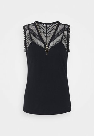 Zwart mouwloos topje met kanten detail op de bovenborst en schouders, V-hals ritssluiting met ronde trekker en golvende kanten rand bij de armsgaten.