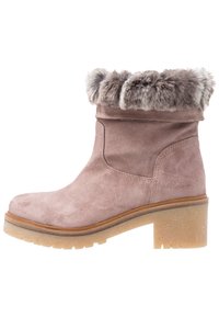 Pink suede boot with a faux fur cuff, rounded toe, and a chunky light-colored heel. The sole has a textured grip pattern.