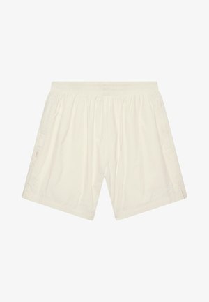 Lyse kremfargede shorts laget av glatt stoff. Har strikk i livet, to sidelommer og en liten logodetalj nederst.