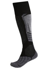 Calcetines hasta la rodilla en negro y gris con un ribete en la parte superior, un patrón de punto texturizado y una puntera reforzada con detalles geométricos.