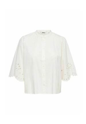 Weiße Bluse mit kurzen Ärmeln, Knopfleiste vorne, rundem Kragen und gezacktem Lochspitzenbesatz an den Ärmeln.