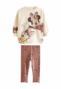 Kreemi värvi puuvillane dressipluus, millel on litritega kaunistatud Minnie Mouse'i print; sobivad roosad retuusid, millel on Minnie nägude muster ja lainelised ääred.