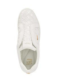 White slip-on sneaker with woven leather texture and smooth finish. Features elastic sides, embossed logo, and cushioned insole.