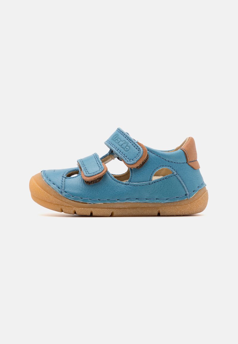 Blue leather sandal featuring two Velcro straps, open sides, and a light brown rubber sole with stitching accents.